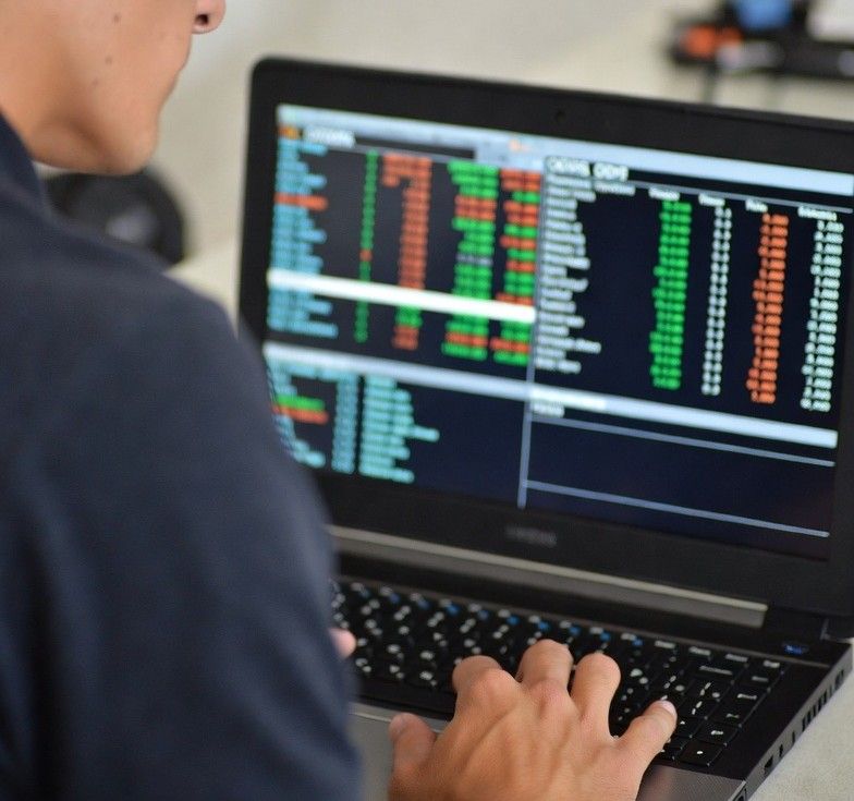 analyzing football statistics on a laptop